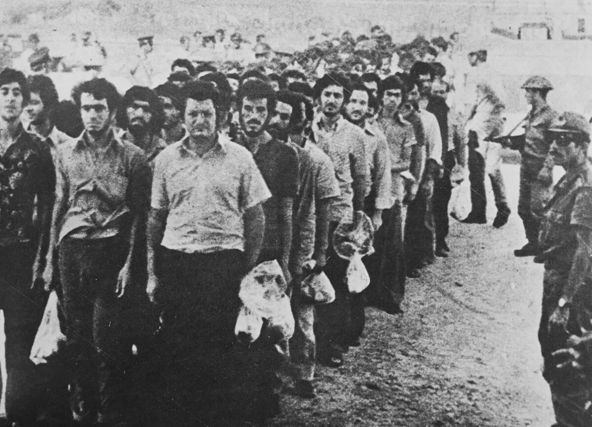 Hundreds of Greek Cypriot prisoners being transferred to Turkey in 1974. Some of the people in this photograph are listed as “disappeared”. (Lobby for Cyprus)