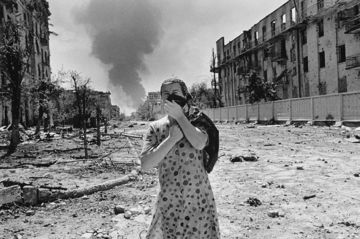 A woman in the urban battleground of Grozny, 1996.